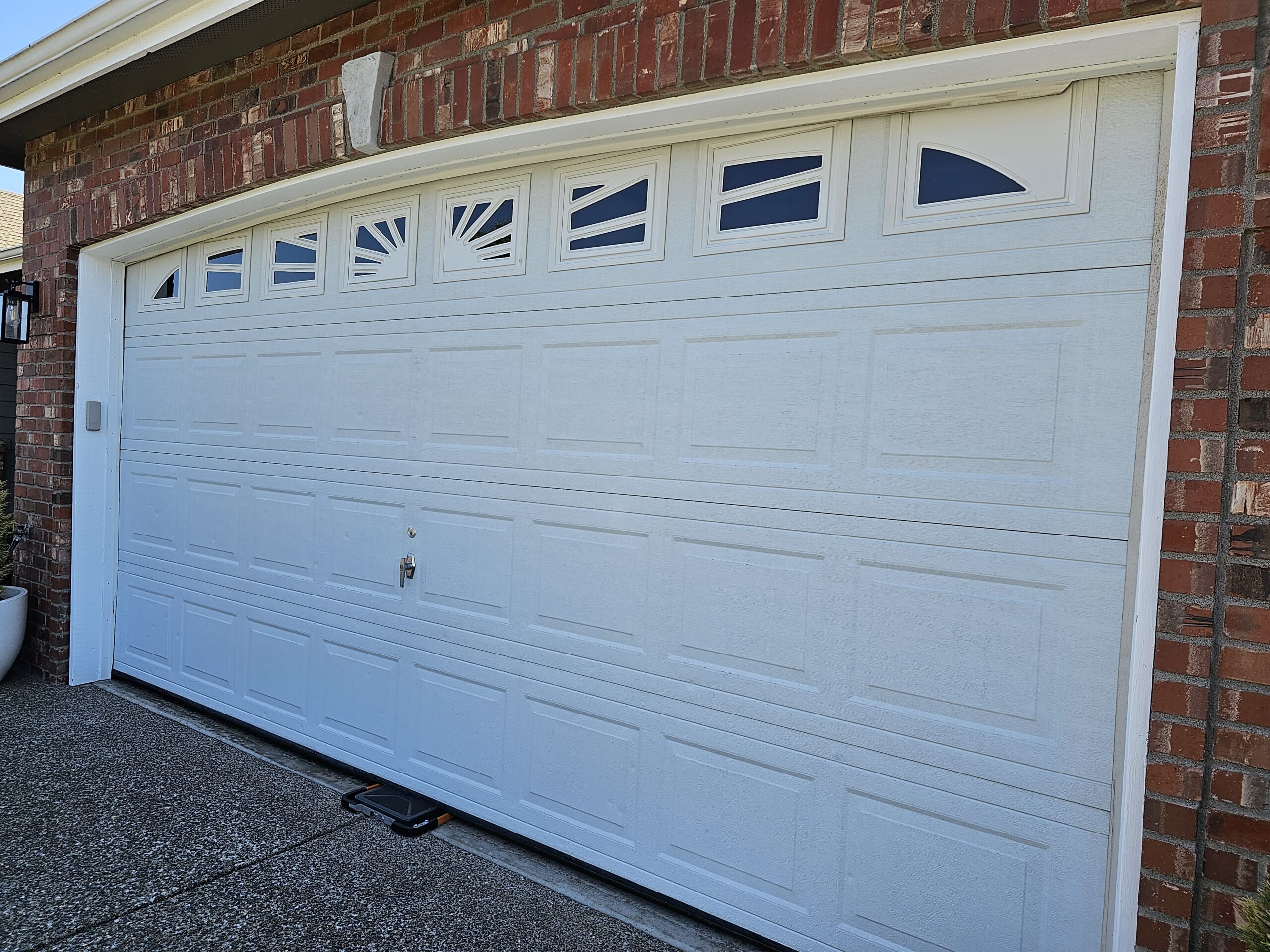 New Garage Door Being Weight
